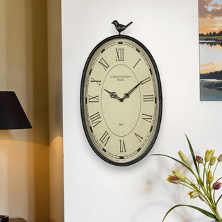  11" Oval Distressed Gunmetal Bird Analog Wall Clock - front product view