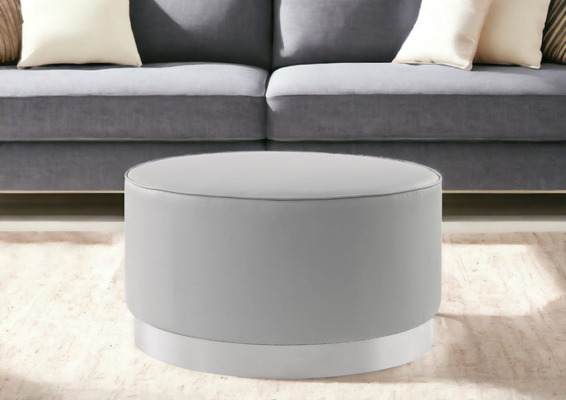 Home Outfitters 31" Gray Faux Leather and Silver Round Cocktail Ottoman