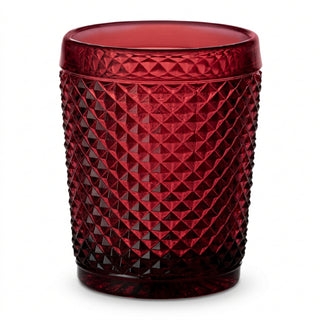 A red glass with a geometric pattern of spikes.